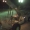 French Payload hanging from Mobile Launch Vehicle at night 